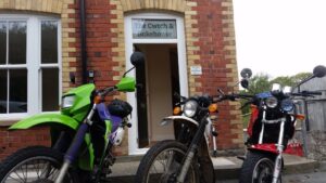 Guests unloading their bikes outside Mid Wales Holiday Lets before taking them into secure storage.